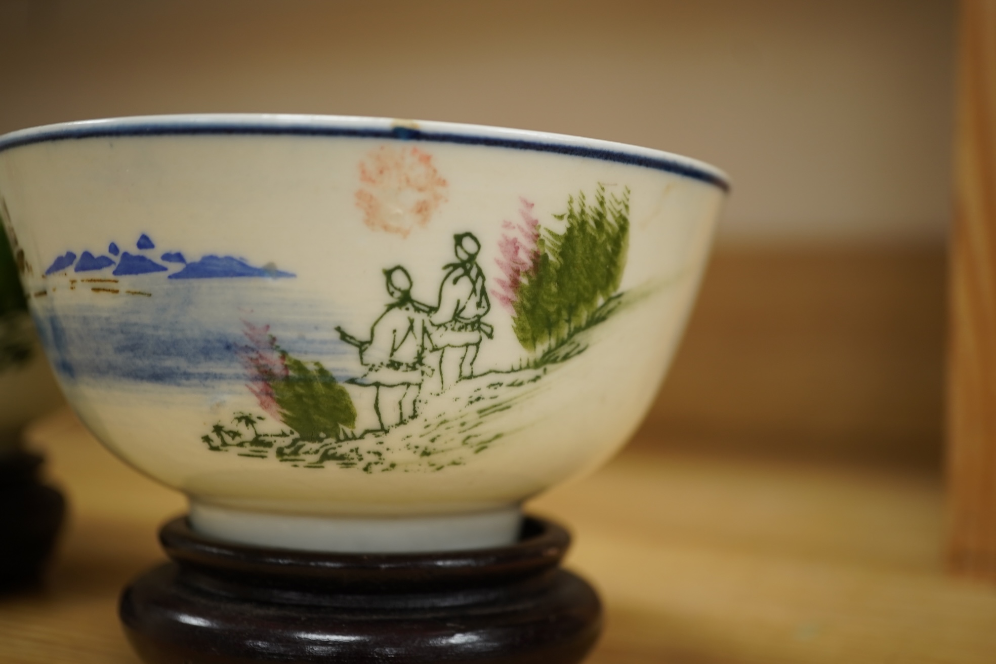 A Chinese Cultural Revolution porcelain teapot, six bowls, wood stands and an enamel tray-29.5cm diameter. (8)